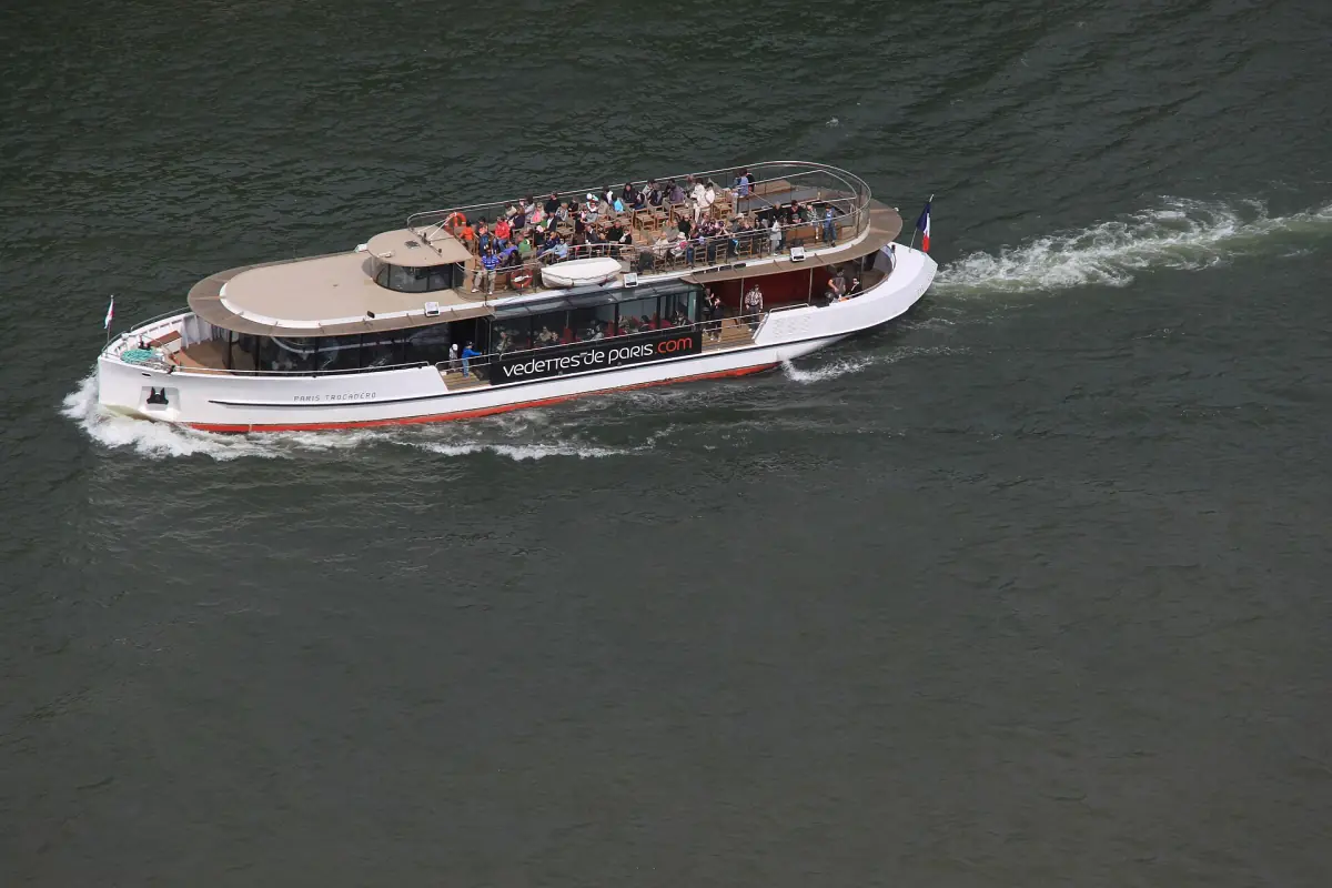A Seine boat seen from the Eiffel Tower